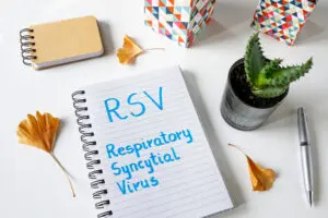 RSV Respiratory Syncytial Virus written in a notebook on white table