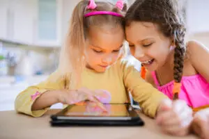 children playing on a tablet