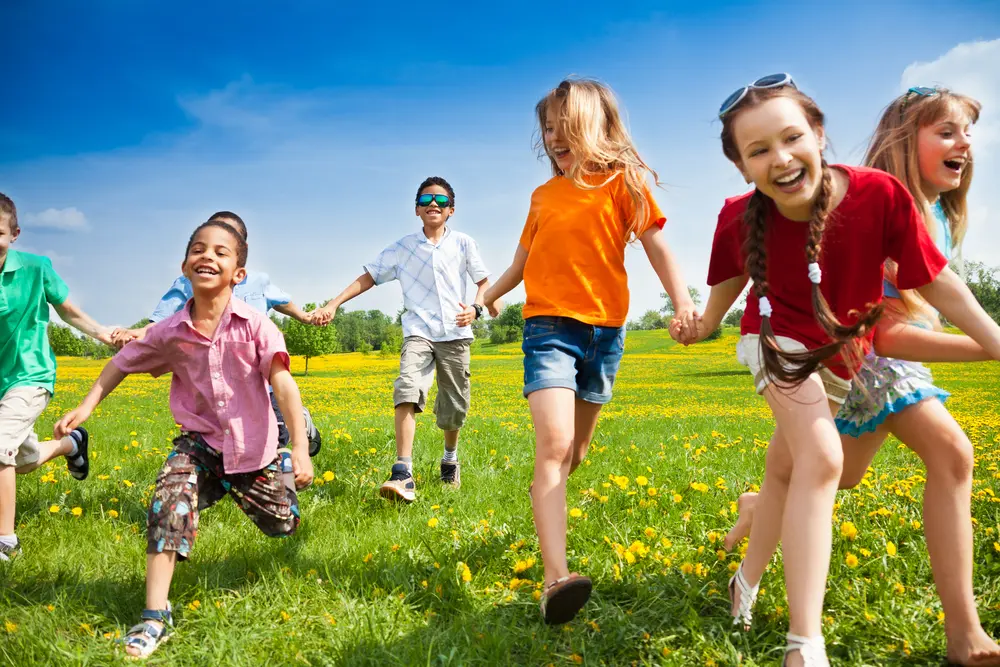 kids playing outside in the sunshine.